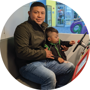 Dad and kid at wheel