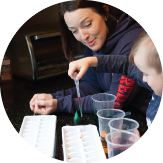 Woman and child with eyedropper