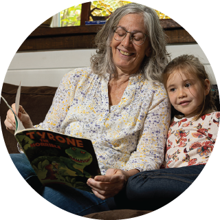 A woman reads to a child
