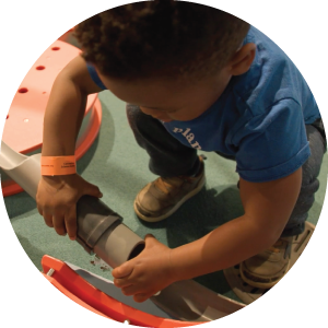 A child working with a pipe