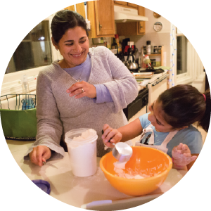 Mother and daughter cooking
