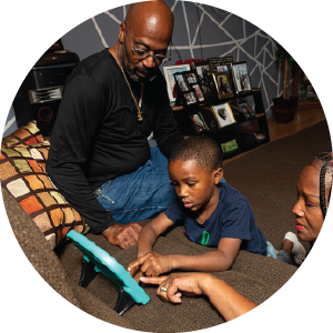 Dad with kid on tablet