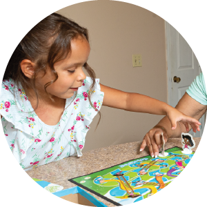 Girl playing chutes and ladders