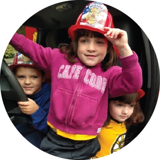 Girl with fire fighter’s hat